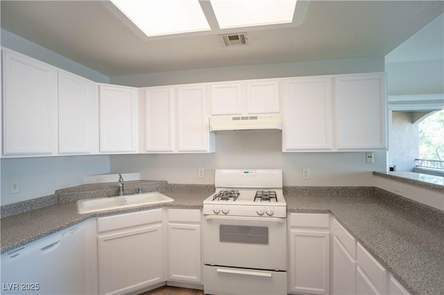 9580 W Reno Ave Unit 240, Las Vegas, NV 89148 - kitchen with white appliances, white cabinetry, and under cabinet range hood