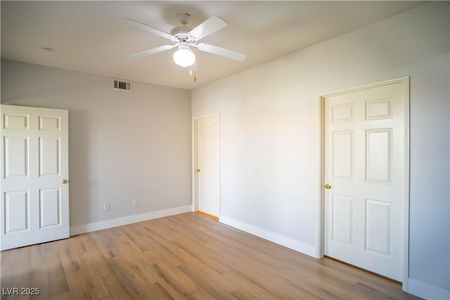 9580 W Reno Ave Unit 240, Las Vegas, NV 89148 - unfurnished bedroom featuring wood finished floors and a ceiling fan