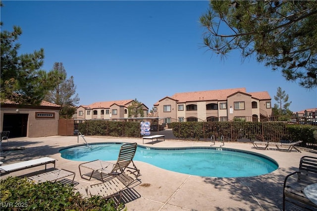 9580 W Reno Ave Unit 240, Las Vegas, NV 89148 - community pool featuring a residential view and a patio area