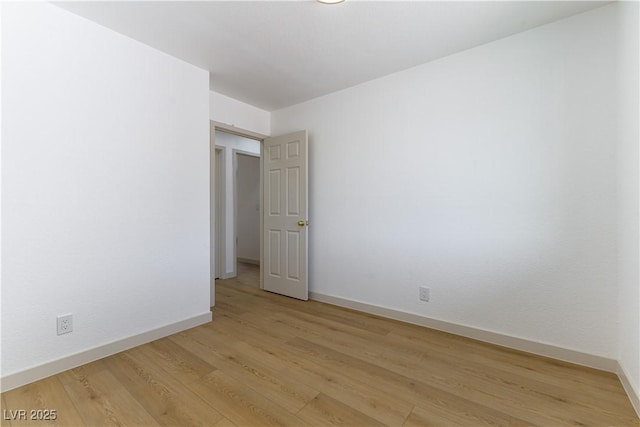 6760 Fallona Ave, Las Vegas, NV 89156 - spare room featuring baseboards and light wood-style flooring