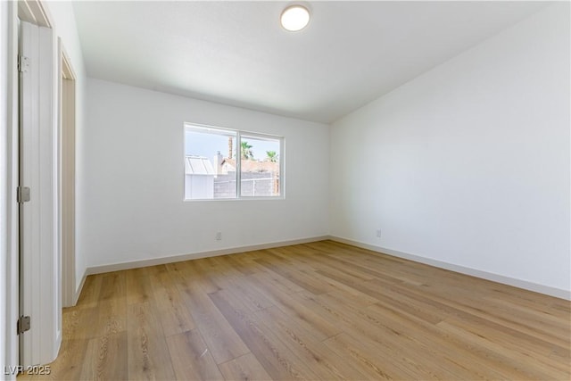 6760 Fallona Ave, Las Vegas, NV 89156 - spare room with light wood-style flooring and baseboards