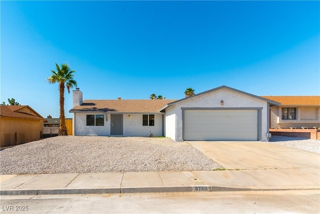 6760 Fallona Ave, Las Vegas, NV 89156 - single story home featuring a garage, concrete driveway, a chimney, and stucco siding