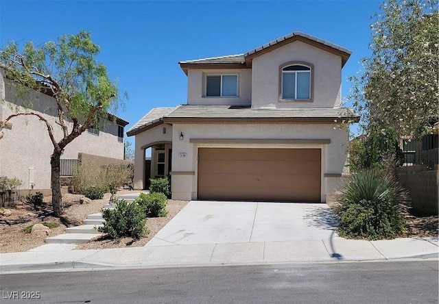 2648 Blairgowrie Dr, Henderson, NV 89044 - view of front of house with driveway, a garage, a tile roof, and stucco siding