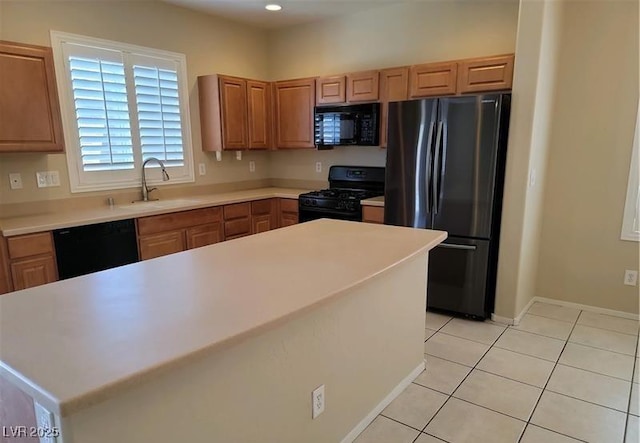 2648 Blairgowrie Dr, Henderson, NV 89044 - kitchen with black appliances, light tile patterned floors, light countertops, and recessed lighting