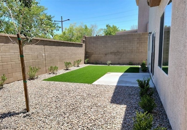 2648 Blairgowrie Dr, Henderson, NV 89044 - fenced backyard featuring a patio
