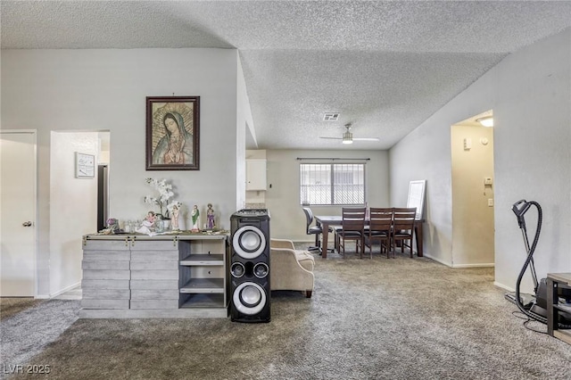729 Concrete Ct, Las Vegas, NV 89110 - carpeted living room featuring ceiling fan and a textured ceiling