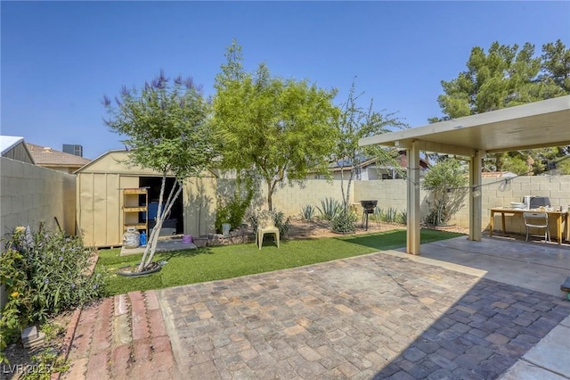 729 Concrete Ct, Las Vegas, NV 89110 - fenced backyard with a storage unit and a patio area