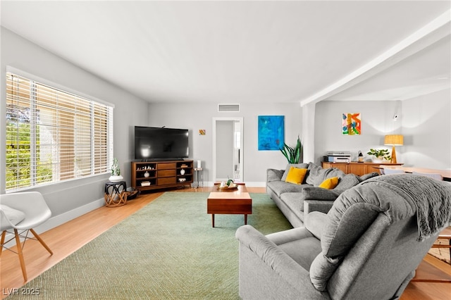 639 Lacy Ln, Las Vegas, NV 89107 - living room with light wood-type flooring and baseboards
