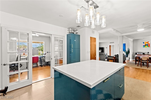 639 Lacy Ln, Las Vegas, NV 89107 - kitchen with an office area, a center island, pendant lighting, a ceiling fan, and light countertops