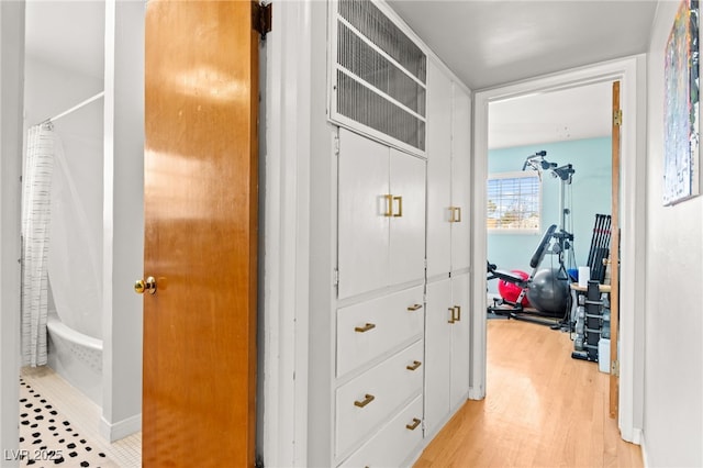 639 Lacy Ln, Las Vegas, NV 89107 - corridor featuring light wood finished floors