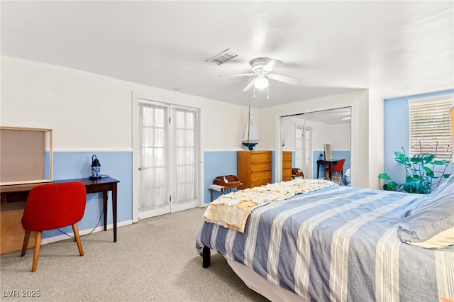 639 Lacy Ln, Las Vegas, NV 89107 - bedroom with carpet flooring, multiple windows, french doors, and ceiling fan