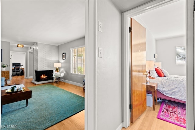 639 Lacy Ln, Las Vegas, NV 89107 - living area featuring wood finished floors and a fireplace