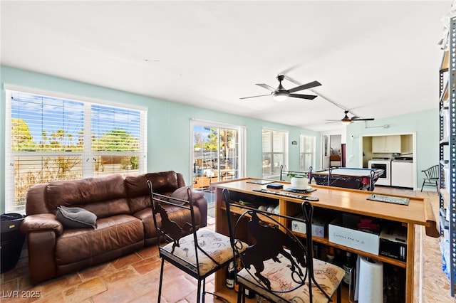 639 Lacy Ln, Las Vegas, NV 89107 - dining room featuring ceiling fan, washer and dryer, and light stone finish floors