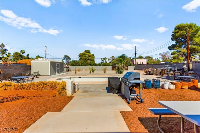 639 Lacy Ln, Las Vegas, NV 89107 - fenced backyard with a shed and a patio area
