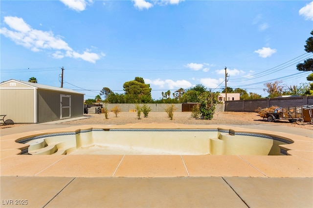 639 Lacy Ln, Las Vegas, NV 89107 - view of pool with a fenced backyard, a storage unit, and a patio area