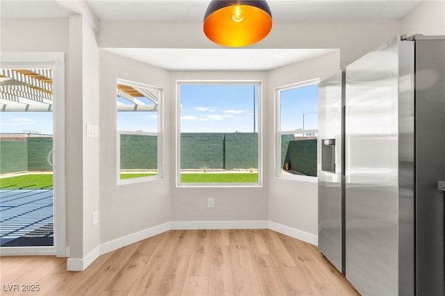 1904 Leaning Pine Way, Las Vegas, NV 89128 - unfurnished dining area featuring light wood-style floors and baseboards
