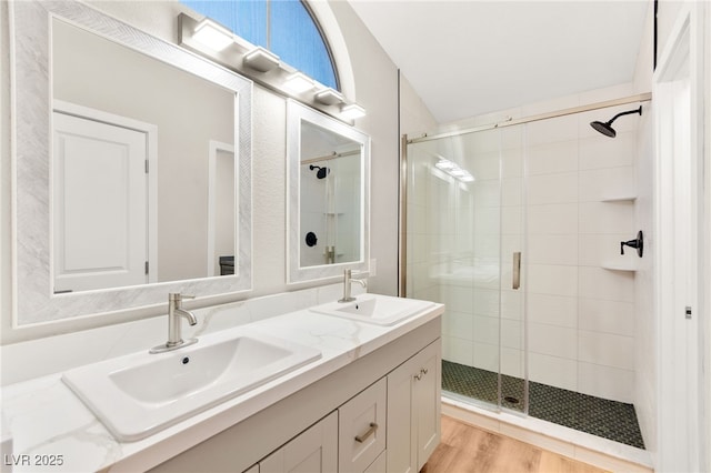 1904 Leaning Pine Way, Las Vegas, NV 89128 - full bathroom featuring a shower stall, double vanity, lofted ceiling, and wood finished floors