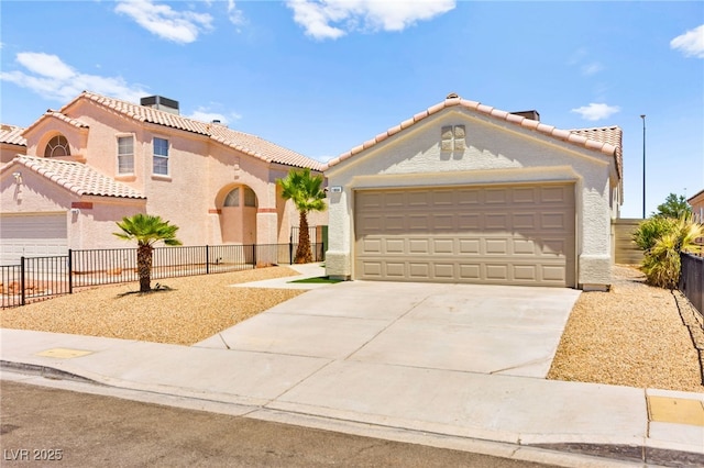 1904 Leaning Pine Way, Las Vegas, NV 89128 - mediterranean / spanish home with a garage, stucco siding, and driveway