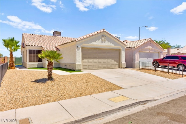 1904 Leaning Pine Way, Las Vegas, NV 89128 - mediterranean / spanish house with a tile roof, stucco siding, driveway, and a garage