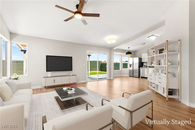 1904 Leaning Pine Way, Las Vegas, NV 89128 - living area featuring light wood-style flooring and a ceiling fan