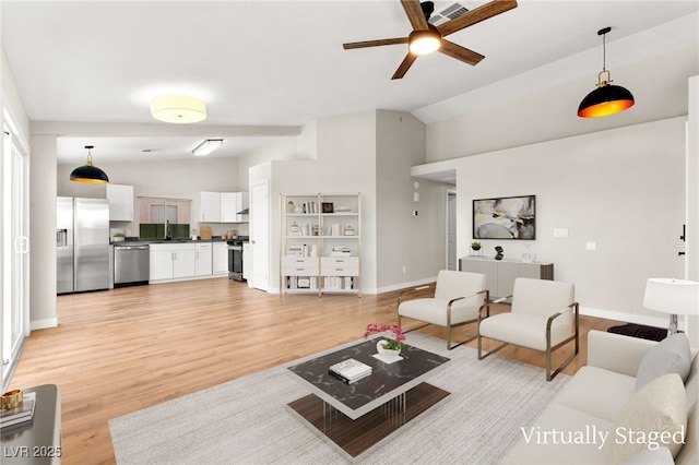 1904 Leaning Pine Way, Las Vegas, NV 89128 - living room with lofted ceiling, ceiling fan, and light wood-style flooring