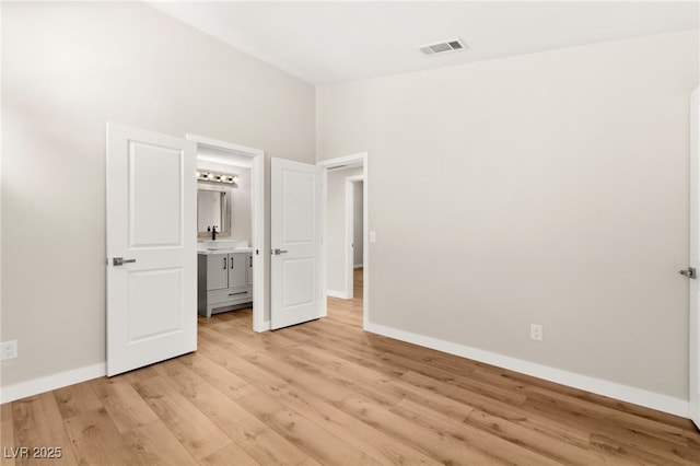 1904 Leaning Pine Way, Las Vegas, NV 89128 - unfurnished bedroom with light wood-style flooring and baseboards