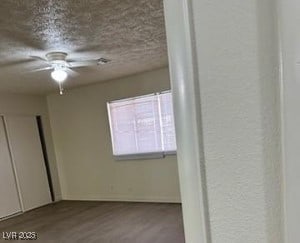 3214 Anacapa Way, Las Vegas, NV 89146 - unfurnished bedroom featuring wood finished floors and a textured ceiling