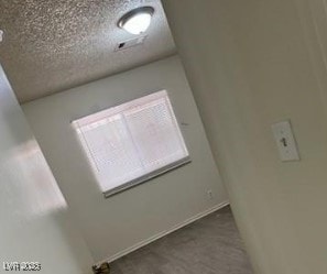 3214 Anacapa Way, Las Vegas, NV 89146 - unfurnished room with a textured ceiling and wood finished floors