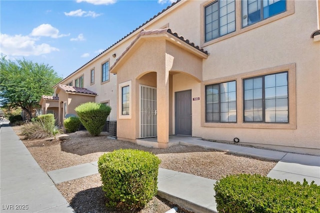 2060 Rancho Lake Dr Unit 103, Las Vegas, NV 89108 - entrance to property with stucco siding and a tiled roof