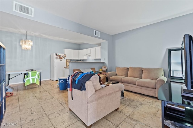 2060 Rancho Lake Dr Unit 103, Las Vegas, NV 89108 - living area with stone tile floors and a chandelier