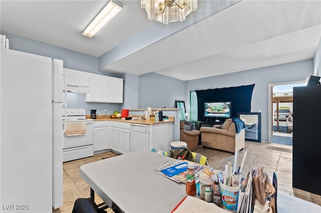 2060 Rancho Lake Dr Unit 103, Las Vegas, NV 89108 - kitchen with white appliances, a chandelier, white cabinetry, light countertops, and under cabinet range hood