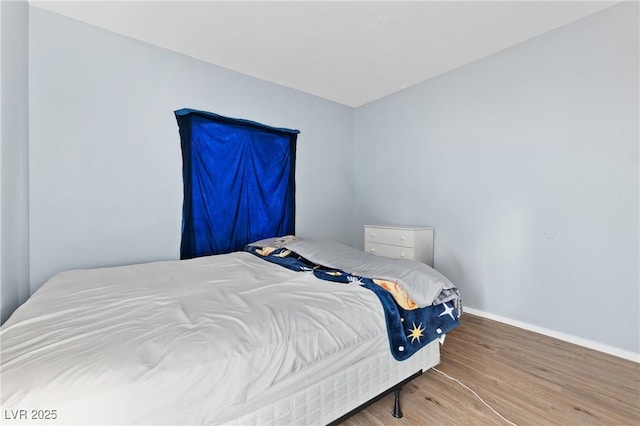 2060 Rancho Lake Dr Unit 103, Las Vegas, NV 89108 - bedroom with wood finished floors and baseboards