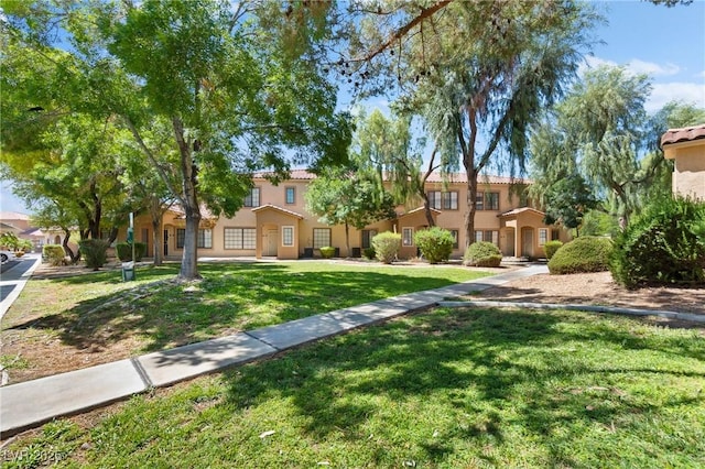 2060 Rancho Lake Dr Unit 103, Las Vegas, NV 89108 - mediterranean / spanish-style house featuring a front yard and stucco siding