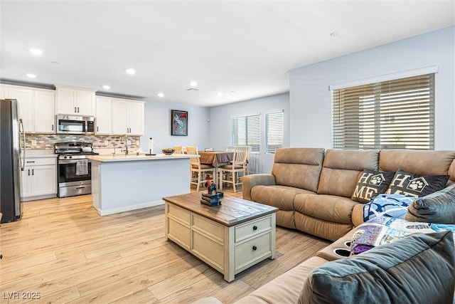 906 Cadence View Way, Henderson, NV 89011 - living area featuring light wood-style floors and recessed lighting
