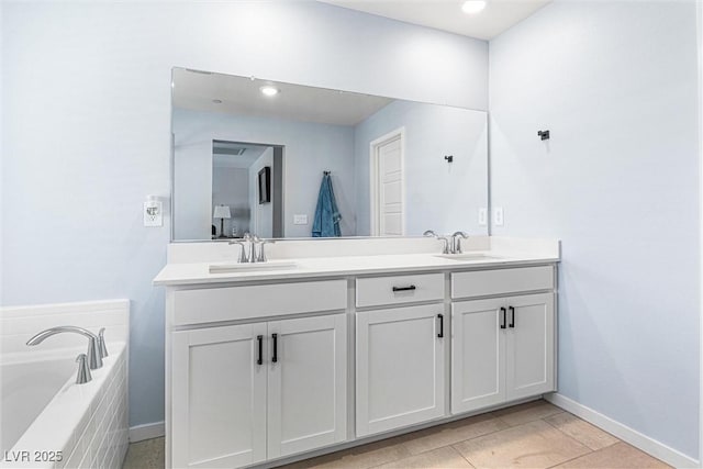 906 Cadence View Way, Henderson, NV 89011 - bathroom with double vanity, a garden tub, and recessed lighting