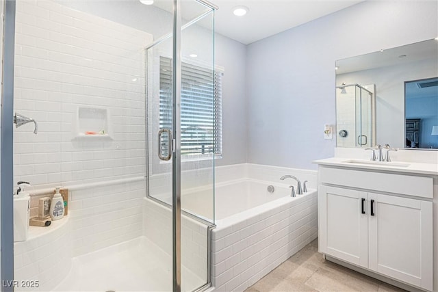 906 Cadence View Way, Henderson, NV 89011 - full bath with vanity, a garden tub, and a stall shower