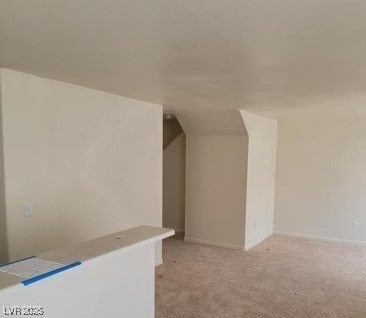 3254 Gold Run St, North Las Vegas, NV 89032 - additional living space with light carpet and vaulted ceiling