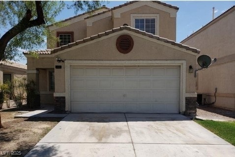 3254 Gold Run St, North Las Vegas, NV 89032 - mediterranean / spanish house with driveway, stucco siding, a tiled roof, and an attached garage