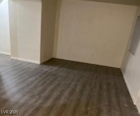 3254 Gold Run St, North Las Vegas, NV 89032 - empty room featuring dark wood-style flooring and baseboards