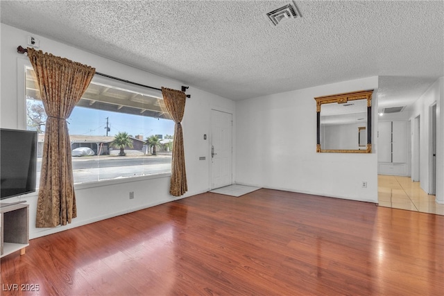 4709 Alpine Pl, Las Vegas, NV 89107 - foyer entrance with wood finished floors and a textured ceiling