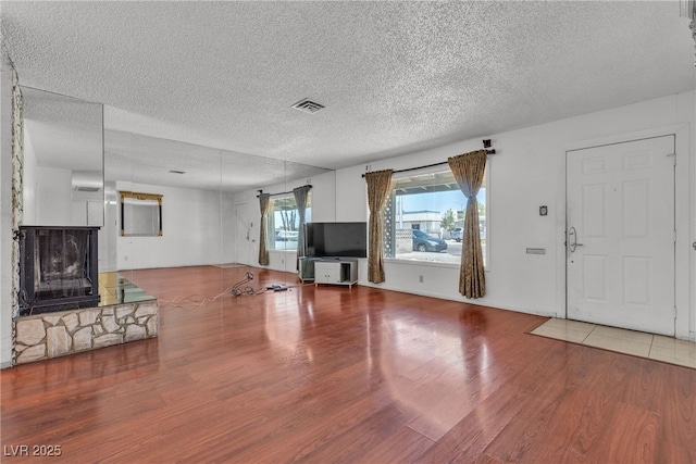 4709 Alpine Pl, Las Vegas, NV 89107 - unfurnished living room with wood finished floors and a textured ceiling