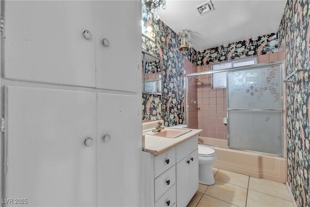 4709 Alpine Pl, Las Vegas, NV 89107 - bathroom featuring tile patterned flooring, vanity, bath / shower combo with glass door, and wallpapered walls