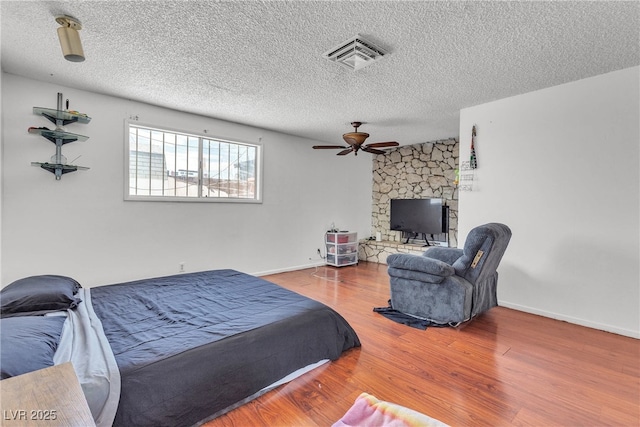 4709 Alpine Pl, Las Vegas, NV 89107 - bedroom featuring a textured ceiling and wood finished floors