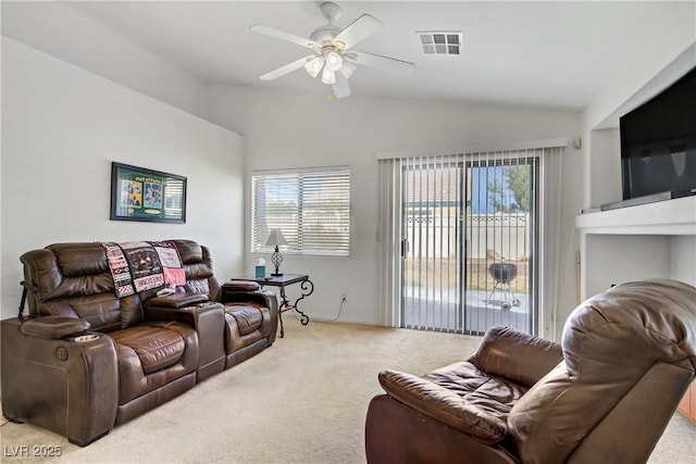 5630 Midnight Breeze St, North Las Vegas, NV 89081 - living room with carpet flooring, vaulted ceiling, plenty of natural light, and ceiling fan