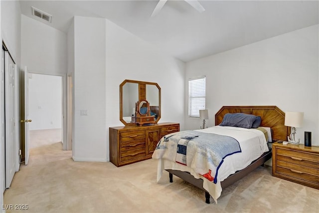 5630 Midnight Breeze St, North Las Vegas, NV 89081 - bedroom with light colored carpet, vaulted ceiling, and a ceiling fan