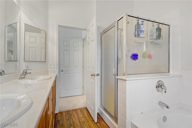 5630 Midnight Breeze St, North Las Vegas, NV 89081 - full bathroom with a shower stall, double vanity, wood finished floors, and a bath