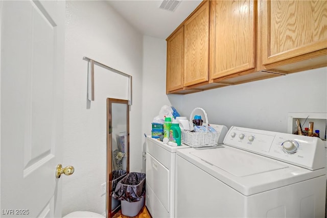 5630 Midnight Breeze St, North Las Vegas, NV 89081 - laundry area featuring washer and dryer and cabinet space