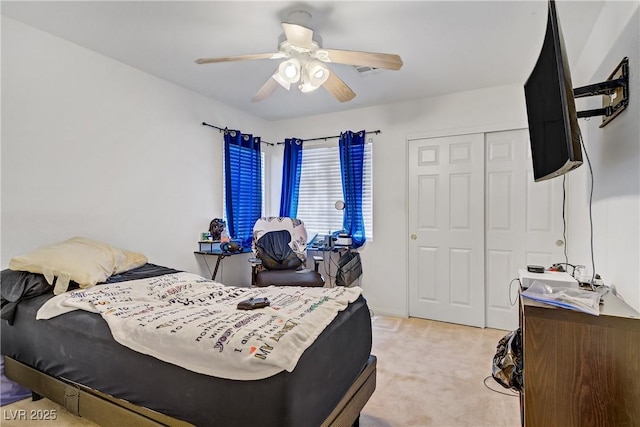 5630 Midnight Breeze St, North Las Vegas, NV 89081 - bedroom featuring light colored carpet, a closet, and a ceiling fan