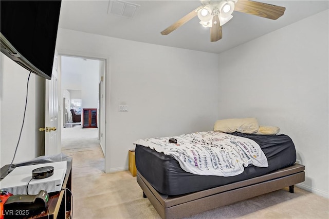 5630 Midnight Breeze St, North Las Vegas, NV 89081 - bedroom with light carpet and a ceiling fan