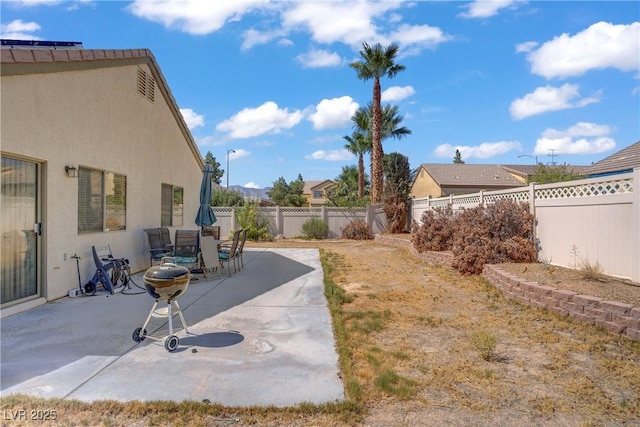 5630 Midnight Breeze St, North Las Vegas, NV 89081 - fenced backyard featuring a patio and outdoor dining space